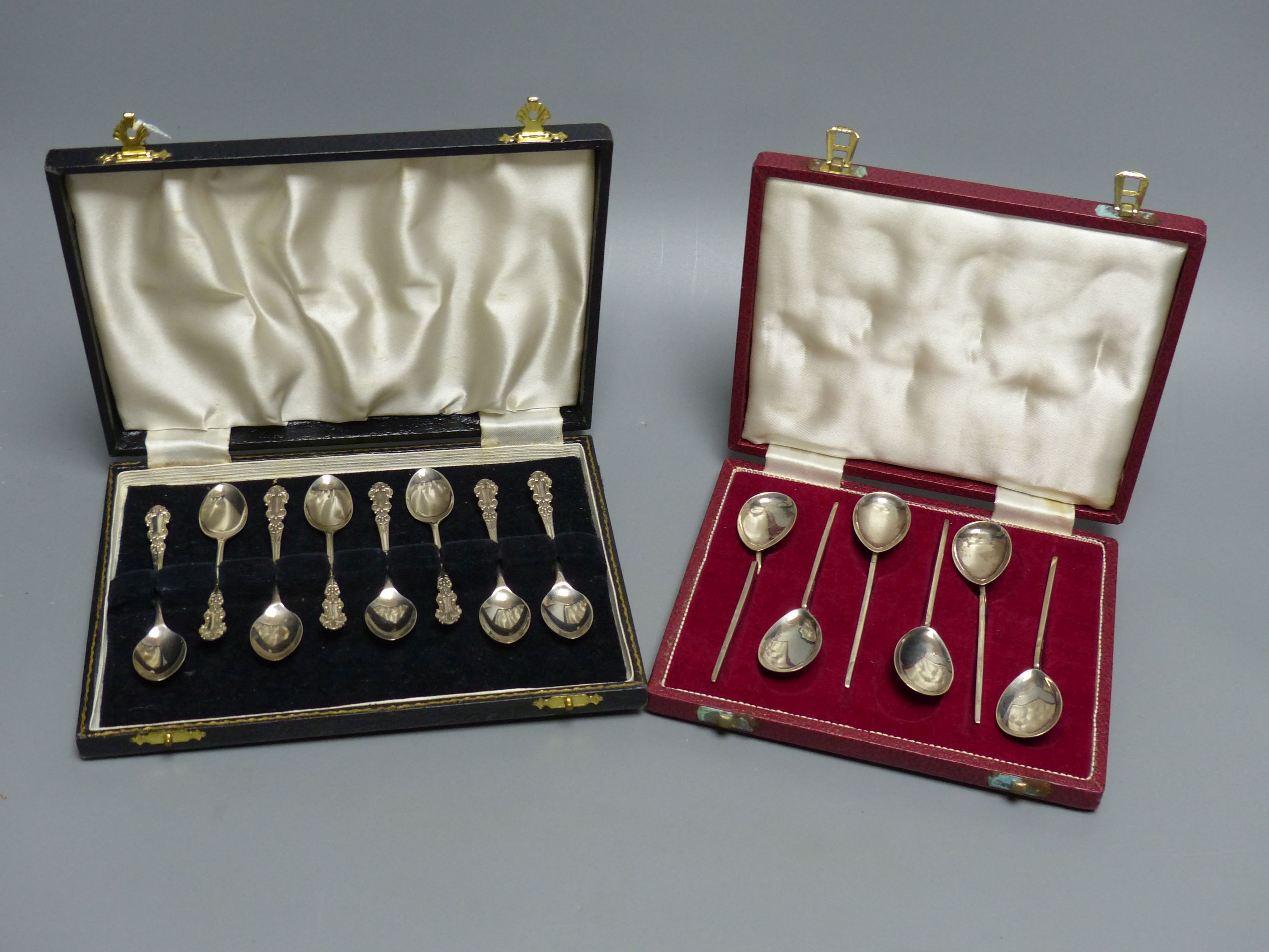 A modern case set of six silver preserve spoons, Sheffield, 1972 and a similar cased set of eight silver coffee spoons.